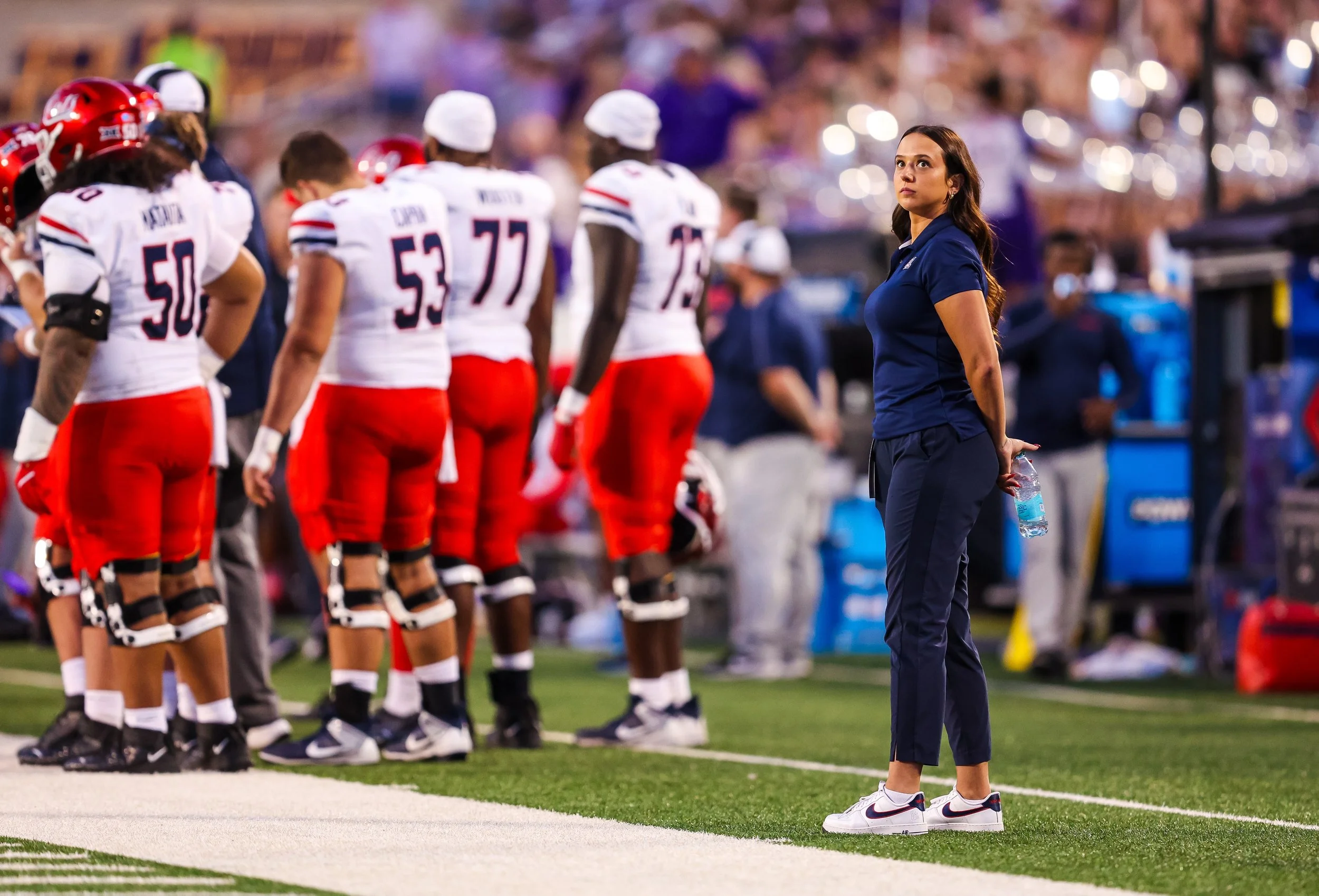 Dr. Kraska on the sideline during a collegiate football game at the University of Arizona